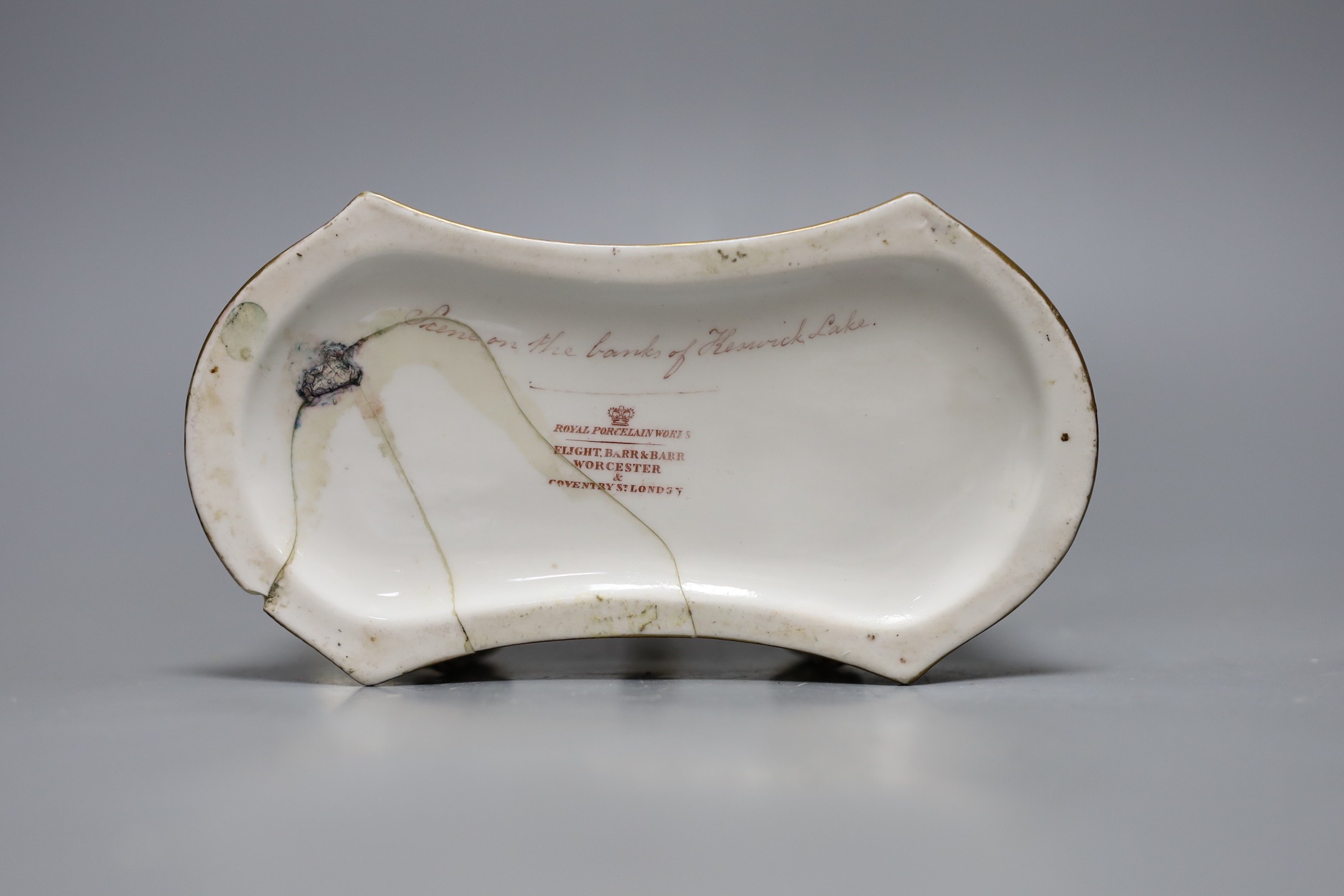 A Flight Barr and Barr ink stand painted with ‘Scene on the banks of Keswick Lake, the handle with serpent heads, printed mark in red, 16 cms wide